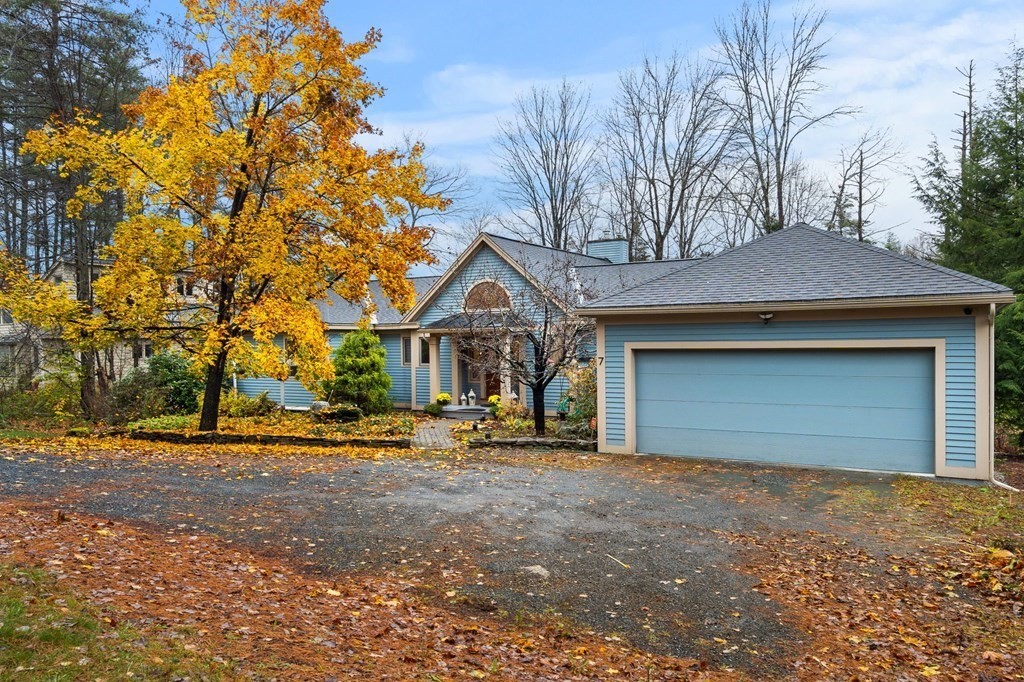 7 Par Brae Grantham, NH 03753 - Photo 2 of 42 a front view of a house with a yard and garage