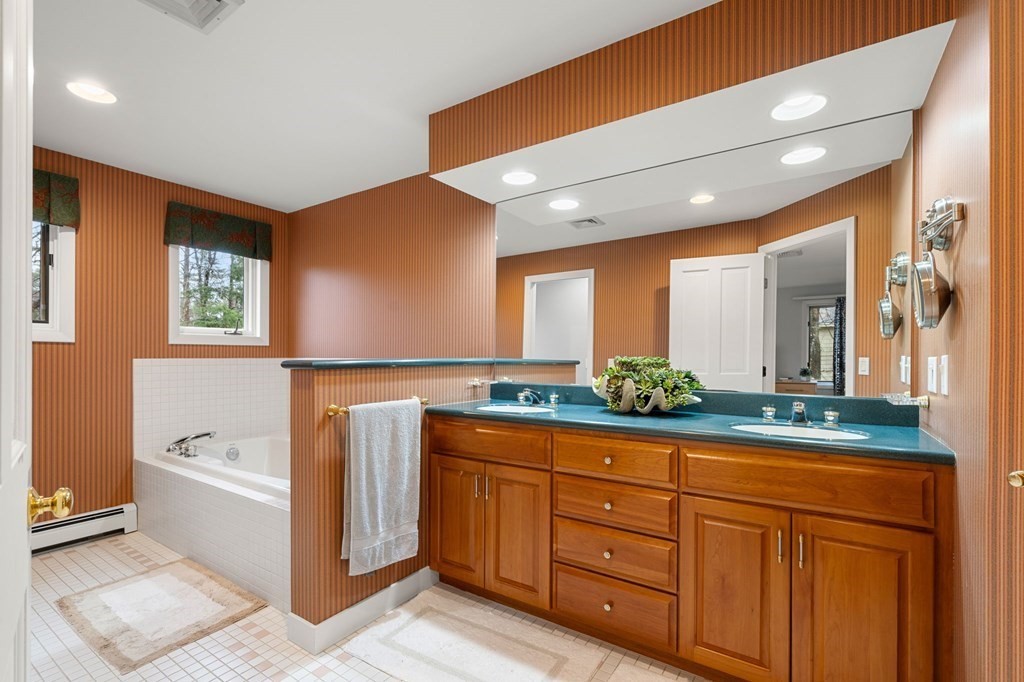 7 Par Brae Grantham, NH 03753 - Photo 23 of 42 a spacious bathroom with a granite countertop sink mirror and bathtub