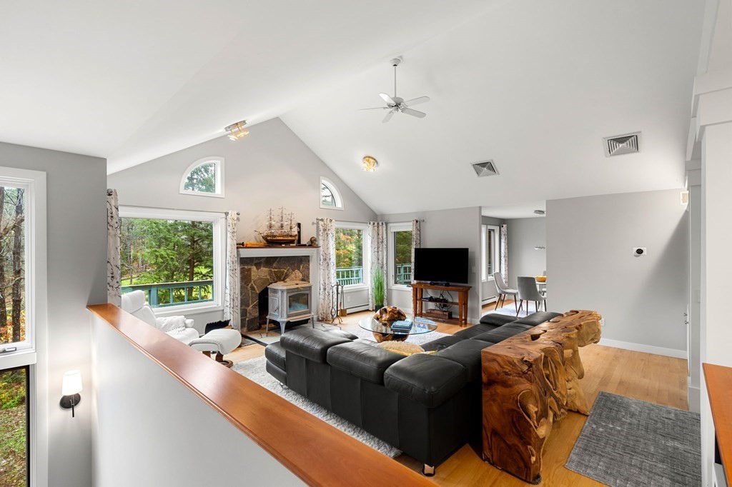 7 Par Brae Grantham, NH 03753 - Photo 24 of 42 a living room with fireplace furniture and a large window