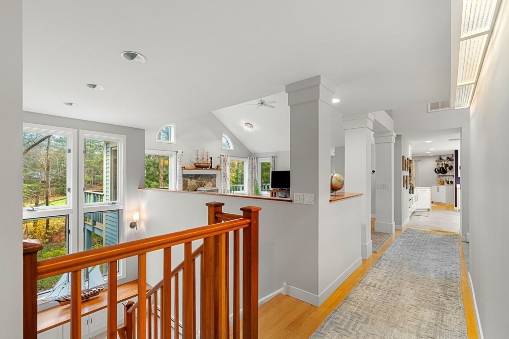 7 Par Brae Grantham, NH 03753 - Photo 25 of 42 a view of a hallway with wooden floor and windows