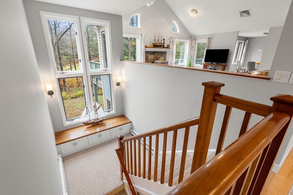7 Par Brae Grantham, NH 03753 - Photo 26 of 42 a view of a hallway with wooden floor and staircase