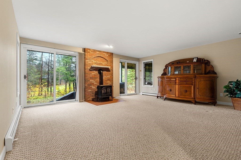 7 Par Brae Grantham, NH 03753 - Photo 30 of 42 an empty room with furniture and floor to ceiling window