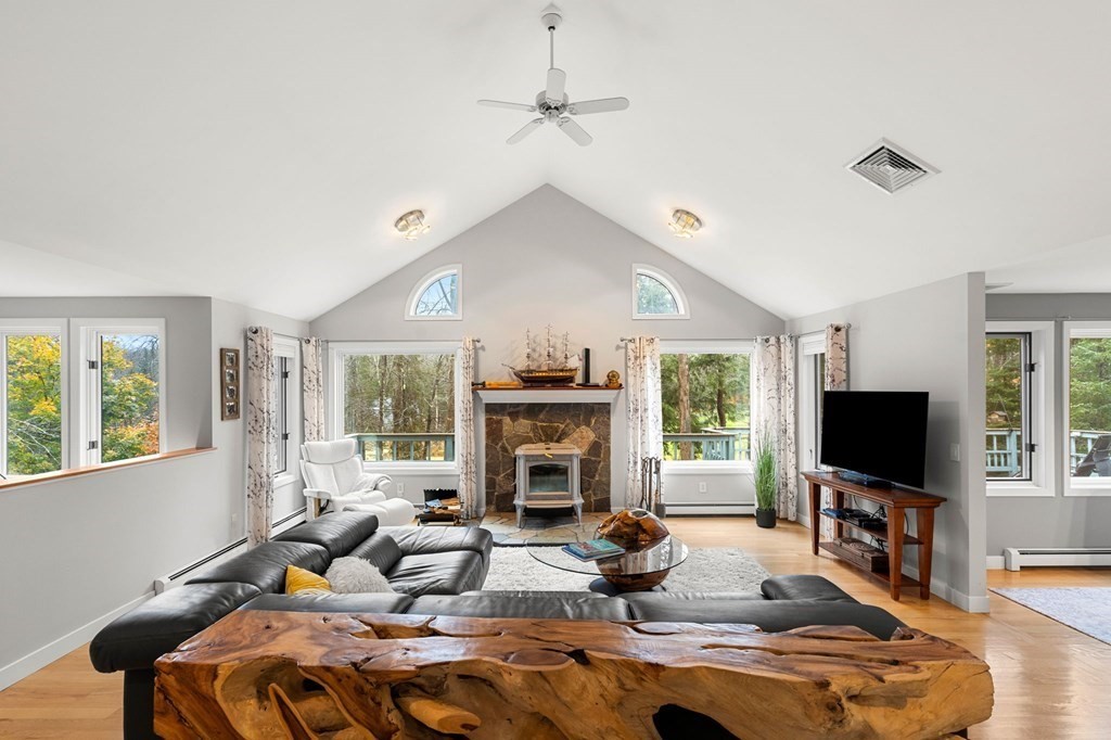 7 Par Brae Grantham, NH 03753 - Photo 5 of 42 a living room with fireplace furniture and a flat screen tv