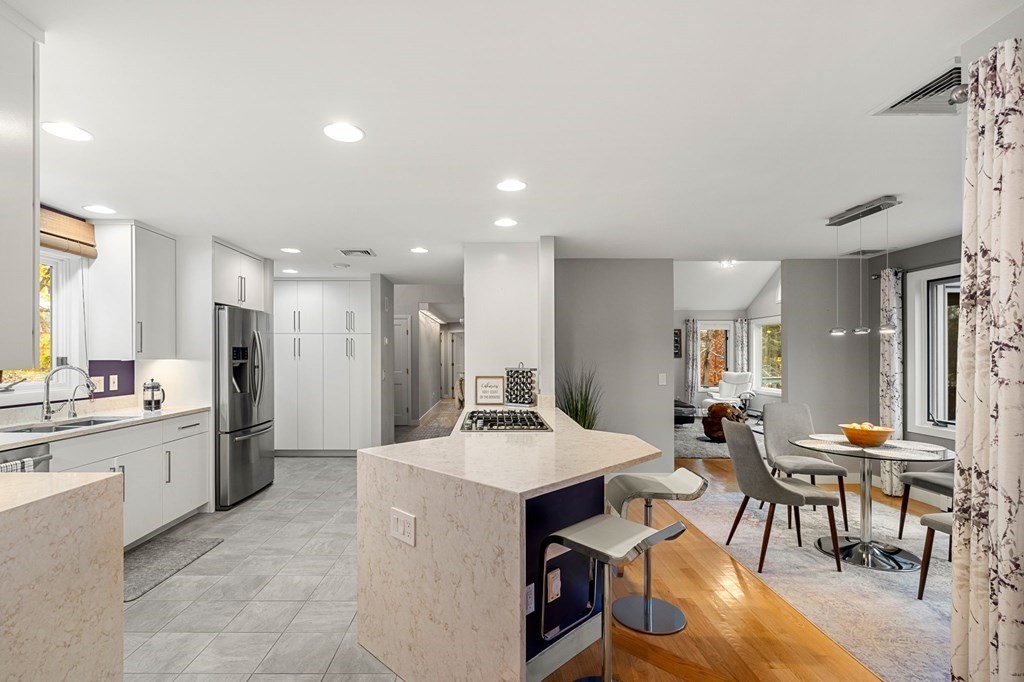 7 Par Brae Grantham, NH 03753 - Photo 9 of 42 a kitchen with a dining table chairs and refrigerator