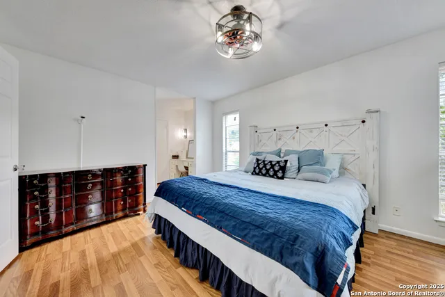 a bed room with a bed and a chandelier