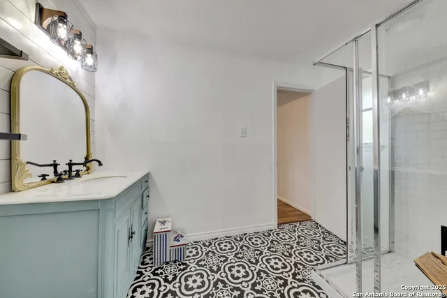 a bathroom with a sink and a mirror