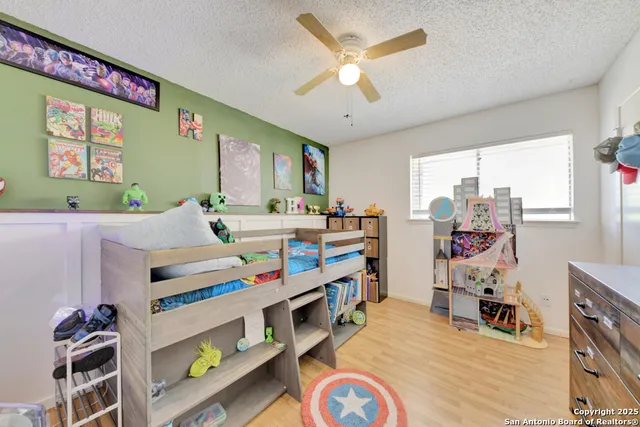 a room with furniture a chandelier and a window