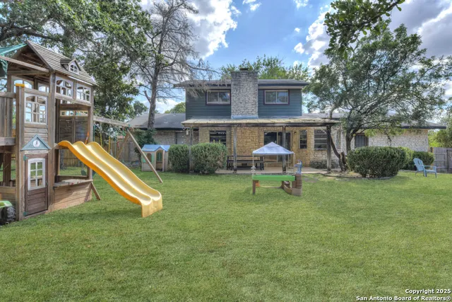 a small house in middle of the green field