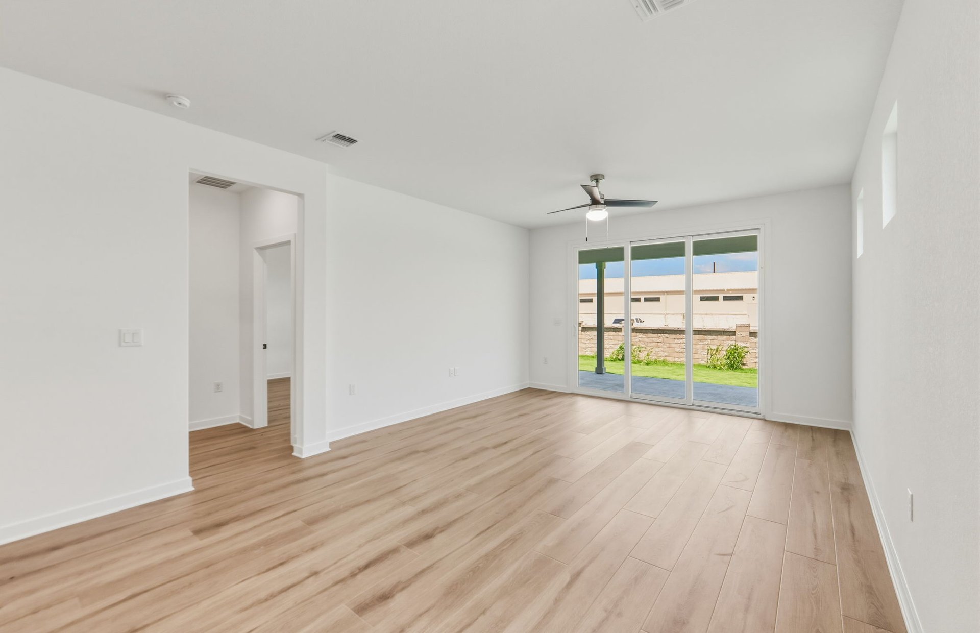 207 Smokestack Lane Georgetown, TX 78633 - Photo 6 of 21 wooden floor in an empty room with a window