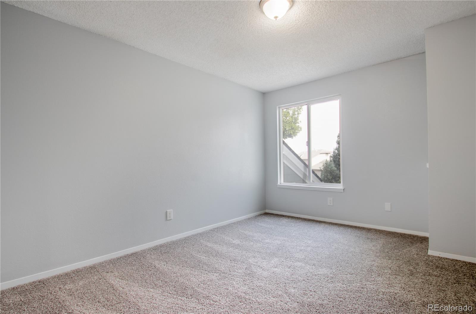 13309 Birch Circle Thornton, CO 80241 - Photo 13 of 25 an empty room with windows