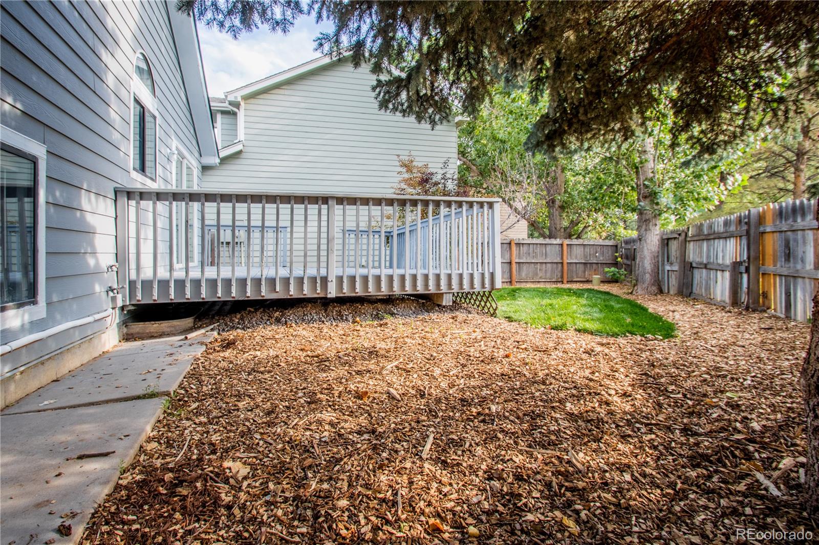 13309 Birch Circle Thornton, CO 80241 - Photo 24 of 25 a view of a backyard with a garden