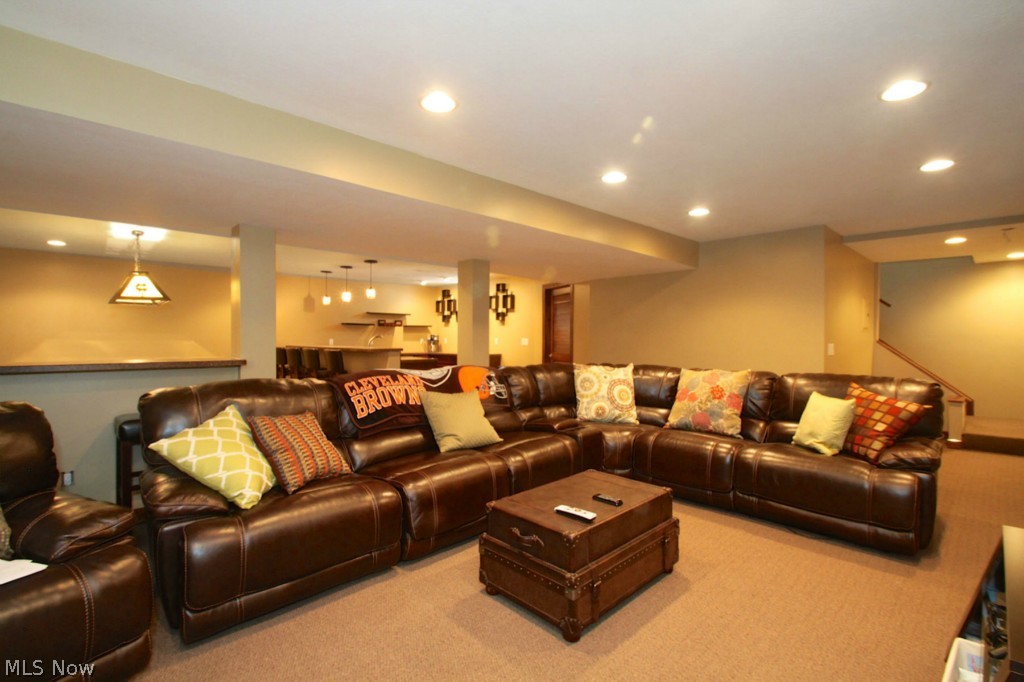 38557 Otten Road North Ridgeville, OH 44039 - Photo 16 of 25 Lower level adds nearly 1,400 additional sq ft of living space. This great room includes a media area, billiards area and a second kitchen.