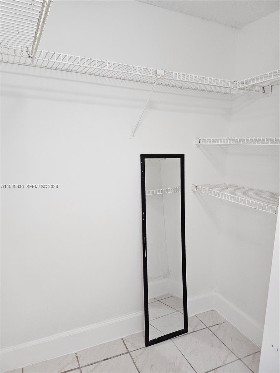 10641 Southwest 108th Avenue, Unit 1H Miami, FL 33176 - Photo 13 of 23 a view of a closet