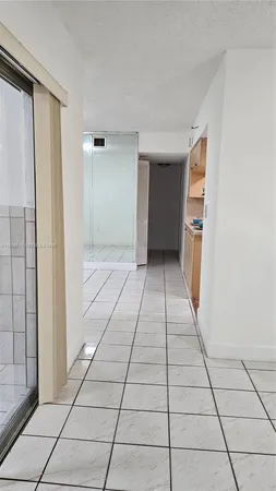 a view of a utility room with windows