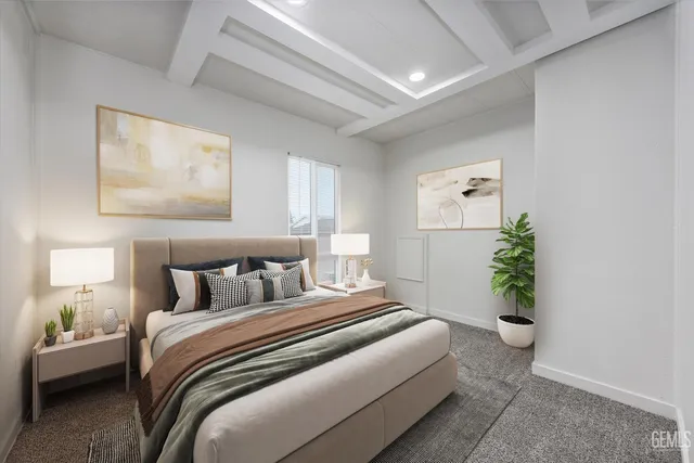 a bedroom with a bed and a potted plant