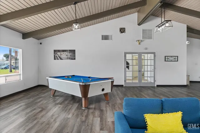 a living room with furniture and kitchen view