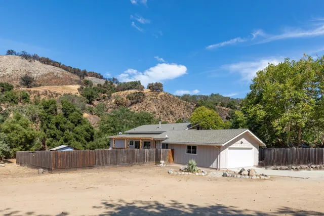 a view of a house with a road