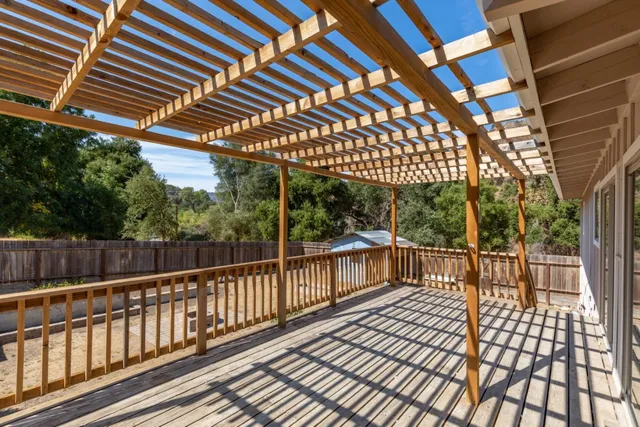 a view of a house with a yard and tree s