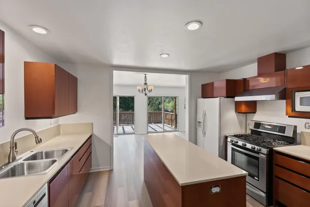 a view of a house with a yard and garage