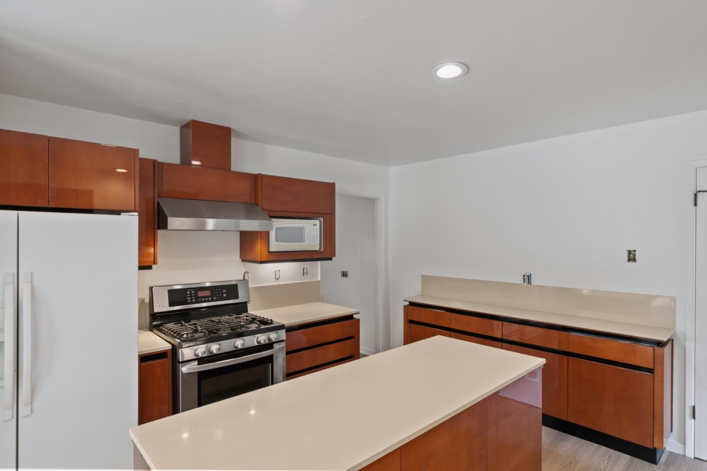 20500 Cachagua Road Carmel Valley, CA 93924 - Photo 30 of 66 a kitchen with stainless steel appliances a stove and a refrigerator