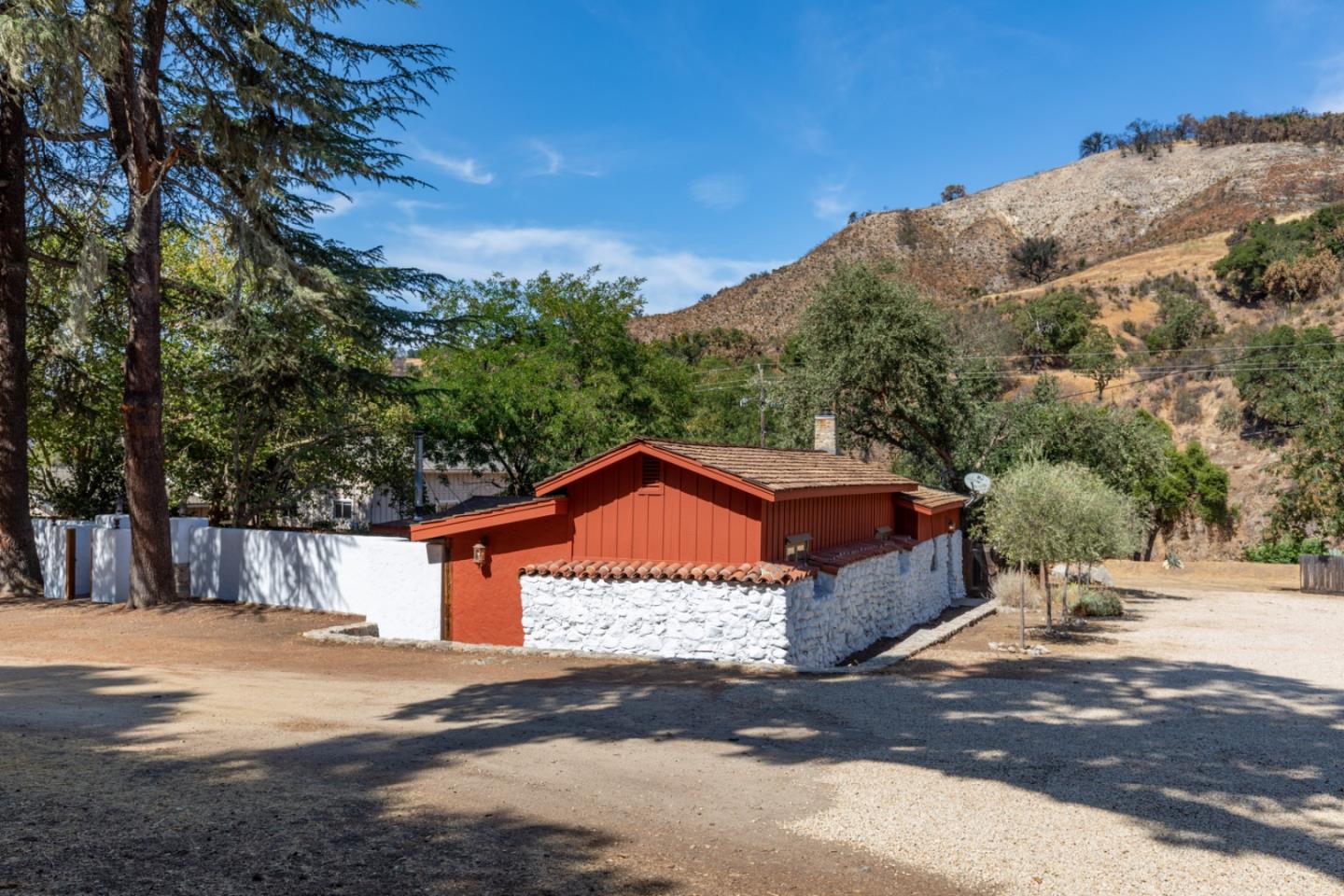 20500 Cachagua Road Carmel Valley, CA 93924 - Photo 33 of 66 a view of a house with a road