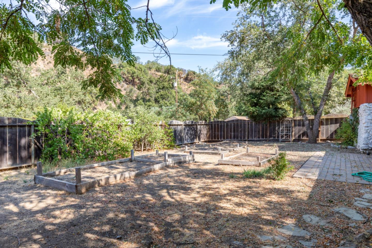 20500 Cachagua Road Carmel Valley, CA 93924 - Photo 37 of 66 a backyard of a house with lots of green space