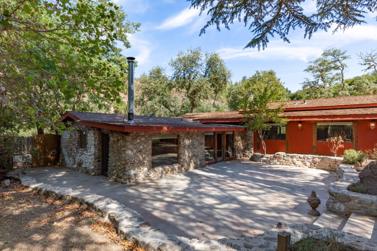 20500 Cachagua Road Carmel Valley, CA 93924 - Photo 38 of 65 a view of a chairs and fire pit in the patio next to a yard