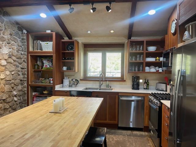 20500 Cachagua Road Carmel Valley, CA 93924 - Photo 46 of 65 a kitchen with stainless steel appliances granite countertop a sink a stove and a refrigerator