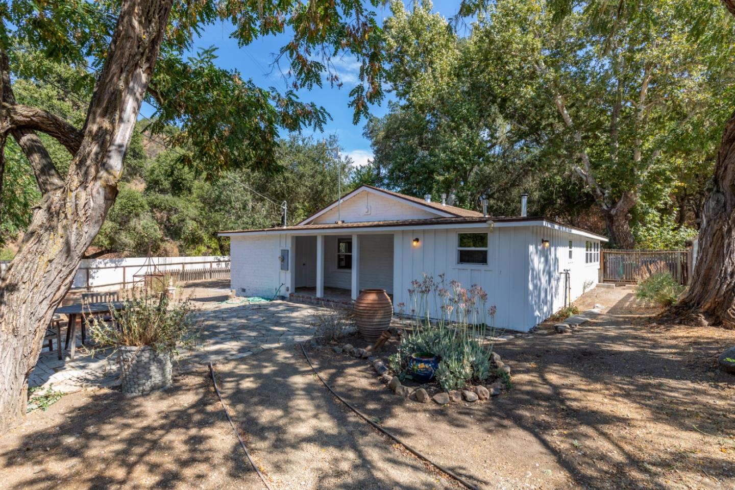 20500 Cachagua Road Carmel Valley, CA 93924 - Photo 6 of 65 a front view of house with yard and trees around