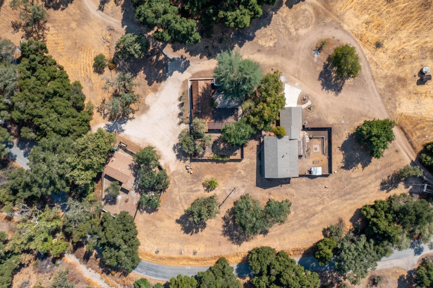 20500 Cachagua Road Carmel Valley, CA 93924 - Photo 64 of 65 an aerial view of a house with a yard and mountain view
