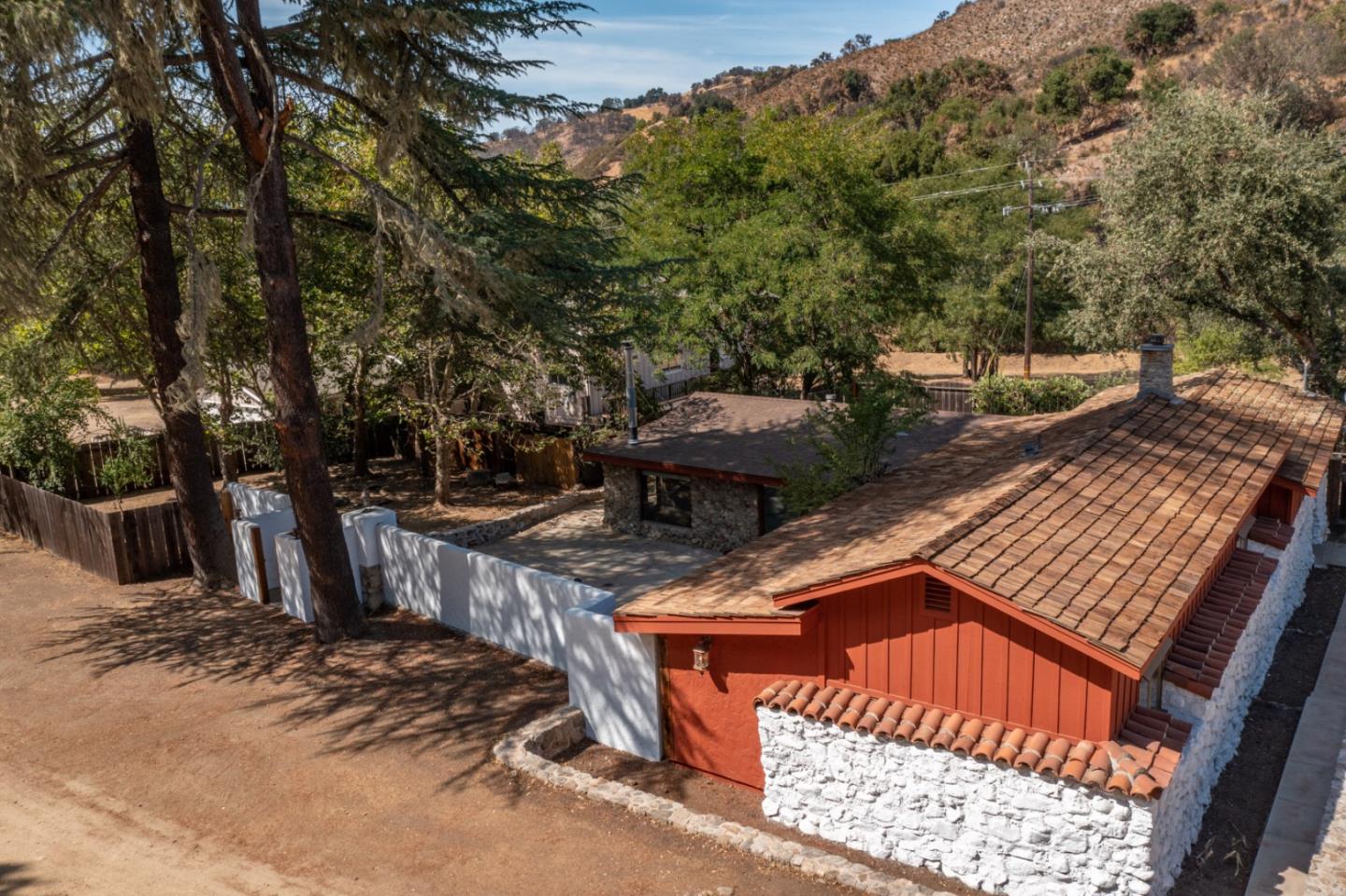 20500 Cachagua Road Carmel Valley, CA 93924 - Photo 64 of 66 a view of a wooden deck and a backyard