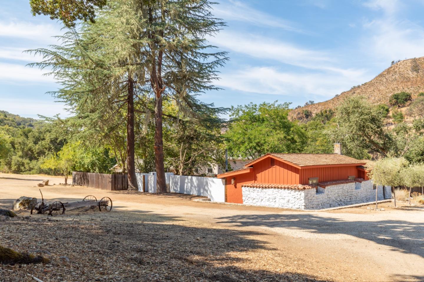20500 Cachagua Road Carmel Valley, CA 93924 - Photo 7 of 66 a front view of a house with a yard and garage