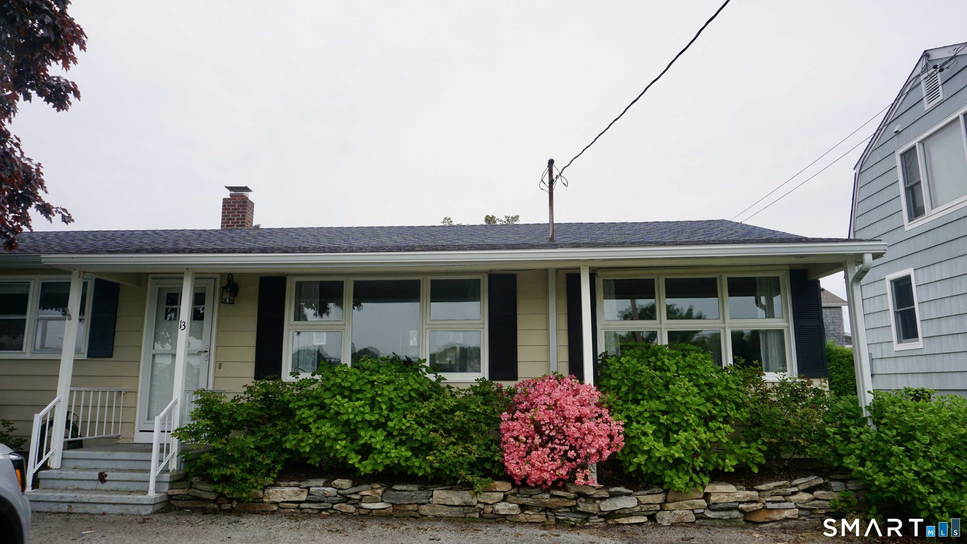 13 Pacific Street Groton, CT 06340 - Photo 2 of 31 a front view of a house with a yard