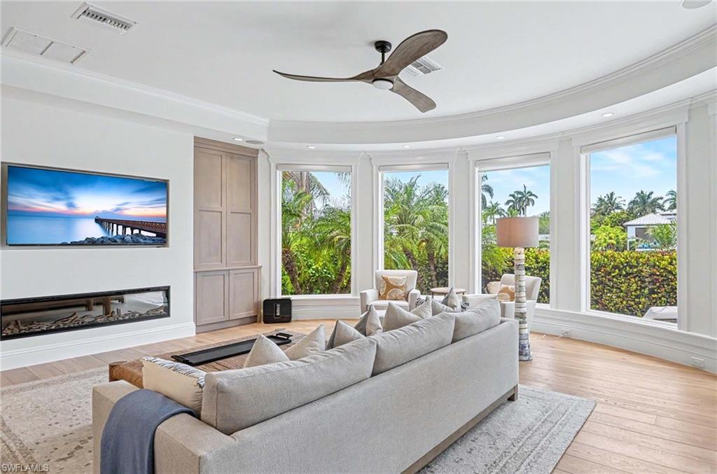 1888 6th Street South Naples, FL 34102 - Photo 6 of 37 a living room with furniture and a large window
