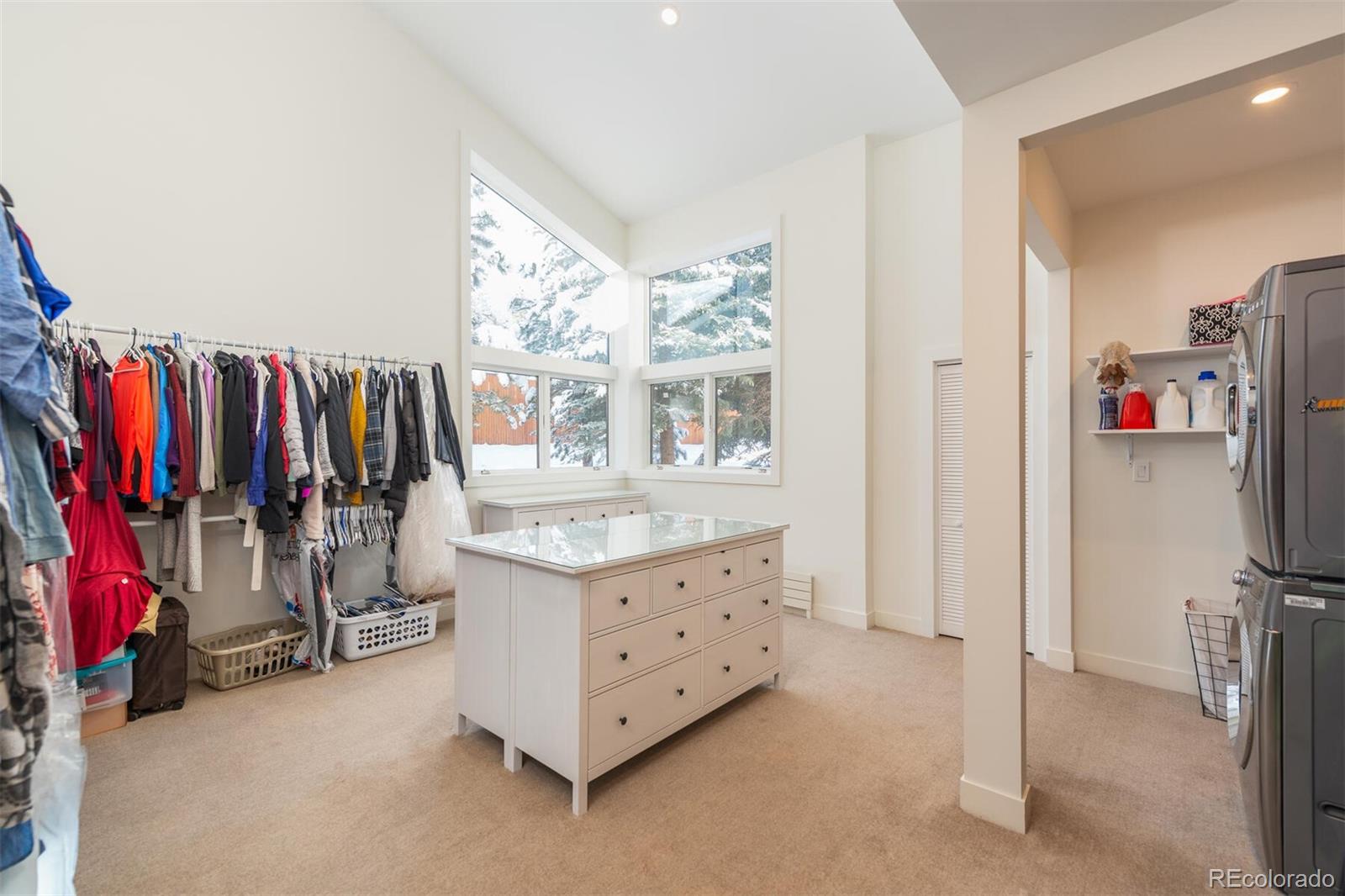 1791 Kerr Gulch Road Evergreen, CO 80439 - Photo 19 of 40 a view of walk in closet with clothes