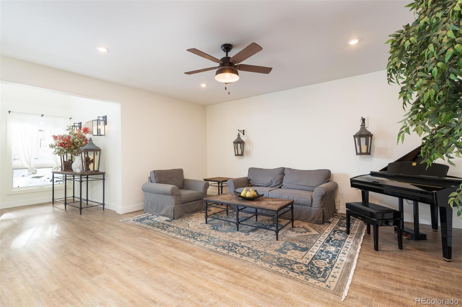 1791 Kerr Gulch Road Evergreen, CO 80439 - Photo 21 of 40 a living room with furniture and a wooden floor
