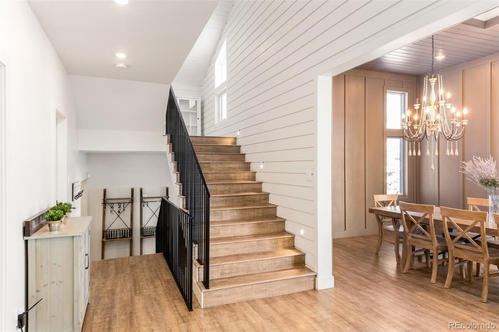 1791 Kerr Gulch Road Evergreen, CO 80439 - Photo 23 of 40 a view of entryway and hall with wooden floor