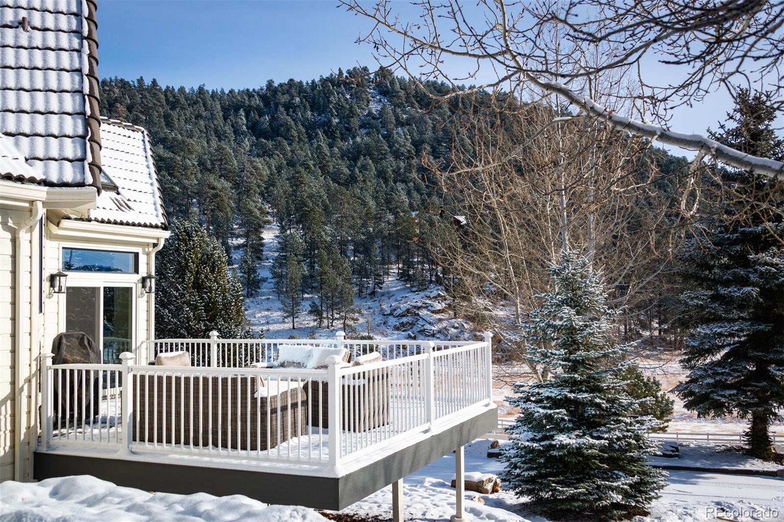 1791 Kerr Gulch Road Evergreen, CO 80439 - Photo 35 of 40 a view of a deck with a trees