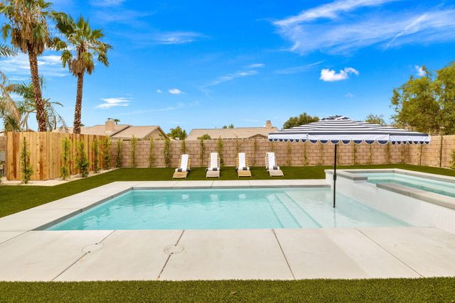 an aerial view of an chairs and tables in the patio