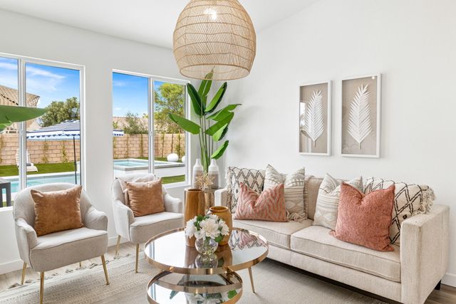 a bedroom with furniture and a potted plant