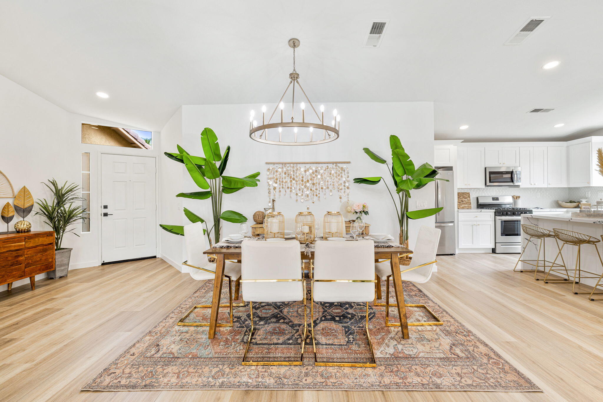 79340 Paseo Del Rey La Quinta, CA 92253 - Photo 27 of 69 a dining room filled chandelier and kitchen view