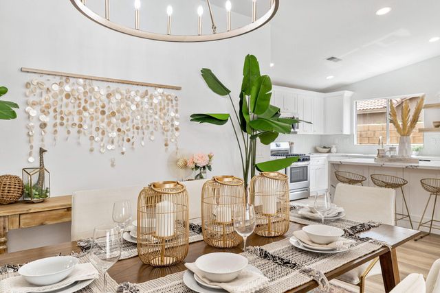 a kitchen with stainless steel appliances granite countertop a stove a refrigerator and a microwave