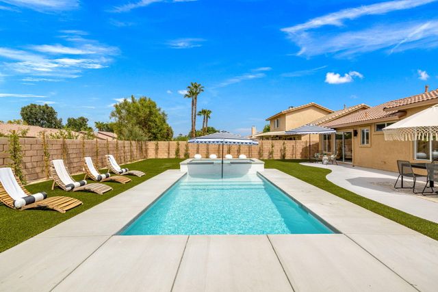 a view of a house with a swimming pool