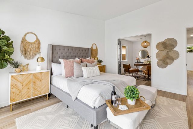 a bathroom with a toilet and a shower curtain