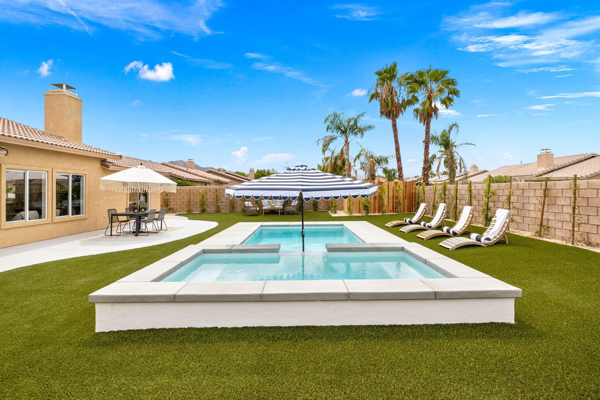 79340 Paseo Del Rey La Quinta, CA 92253 - Photo 6 of 69 a view of a swimming pool with a table and chairs