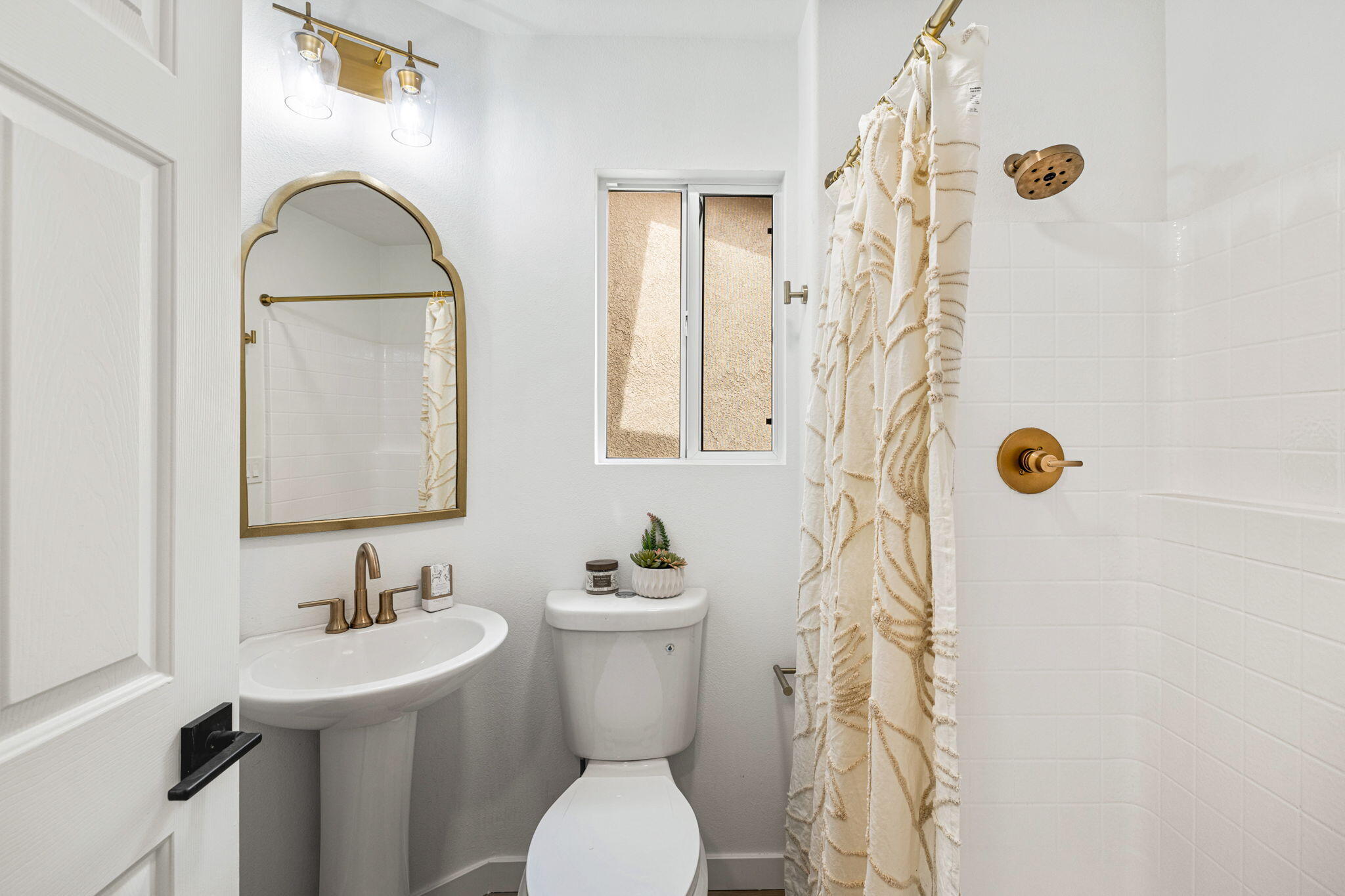 79340 Paseo Del Rey La Quinta, CA 92253 - Photo 65 of 69 a bathroom with a sink a toilet and shower curtain