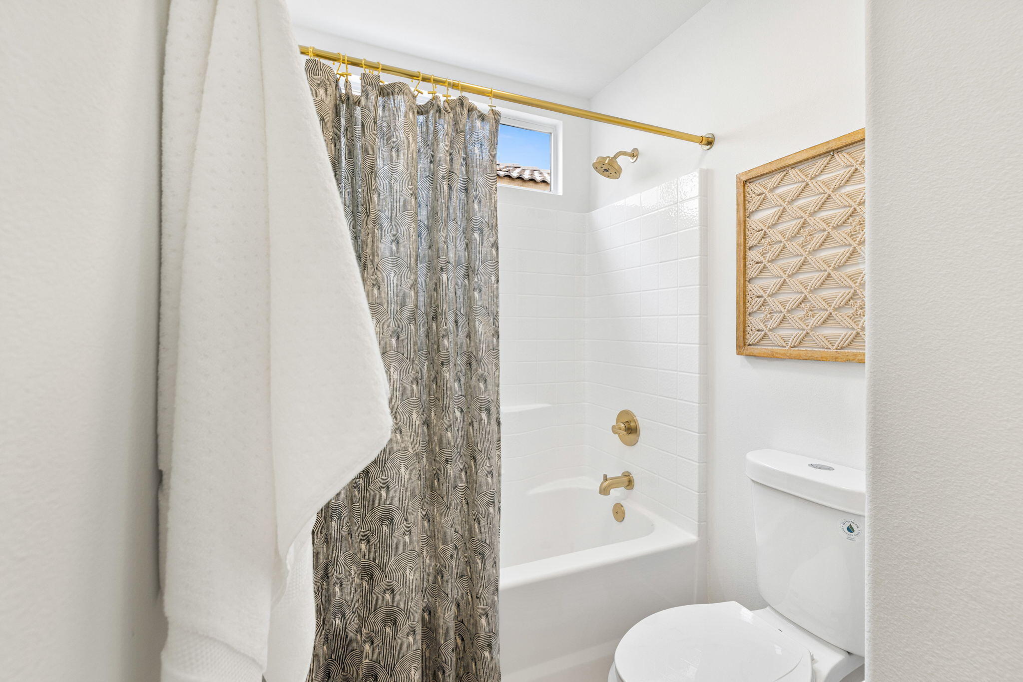 79340 Paseo Del Rey La Quinta, CA 92253 - Photo 68 of 69 a bathroom with a toilet and a shower curtain