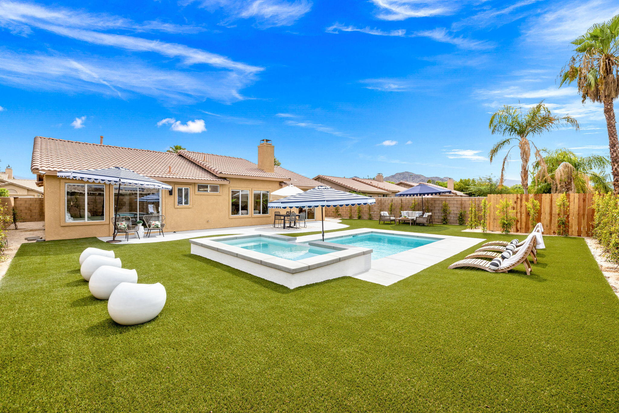 79340 Paseo Del Rey La Quinta, CA 92253 - Photo 8 of 69 a view of a white house with a swimming pool