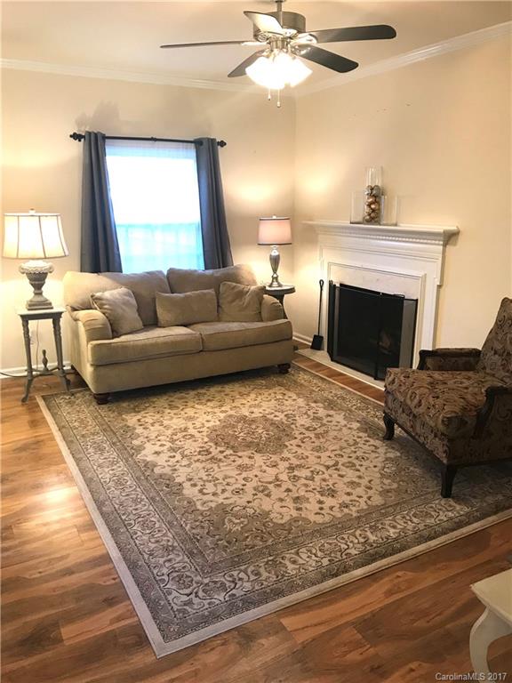 5941 Quail Hollow Road Charlotte, NC 28210 - Photo 2 of 20 a living room with furniture and a fireplace