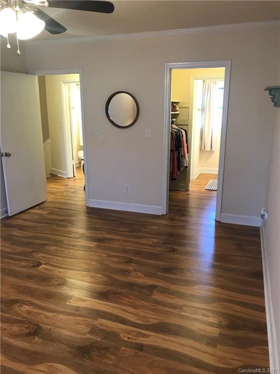 5941 Quail Hollow Road Charlotte, NC 28210 - Photo 11 of 20 a view of a livingroom with wooden floor
